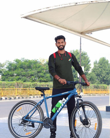 Men ride hybrid and mtb cycle